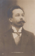 Load image into Gallery viewer, Vintage postcard of a man with a mustache wearing a suit and tie.
