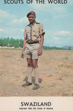 Load image into Gallery viewer, Scout in uniform standing outdoors with text &#39;Scouts of the World&#39; and &#39;Swaziland&#39;.
