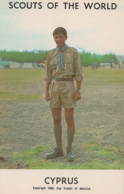 Scout in uniform standing outdoors with 'Scouts of the World' and 'Cyprus' text at the top.