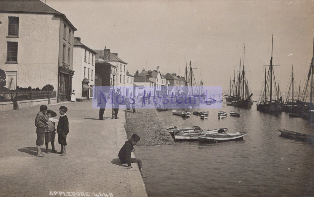 Vintage photograph of children by a harbor with boats and buildings in the background