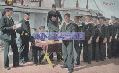Vintage postcard of sailors on a ship with a man in uniform standing at a table.