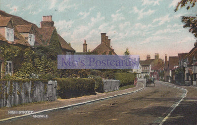Vintage postcard of a street scene with horse-drawn carriage, houses, and trees.