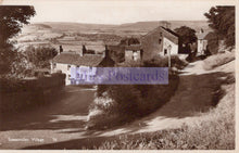 Load image into Gallery viewer, Vintage black and white photo of a village with houses and a road.
