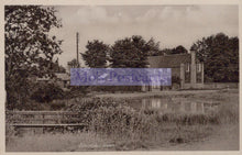 Load image into Gallery viewer, Vintage black and white photo of a pond with trees and buildings in the background
