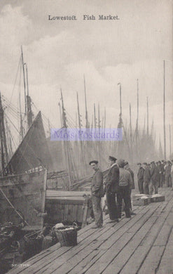 Vintage black and white photograph of a fish market in Lowestoft with people and boats.