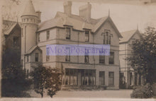 Load image into Gallery viewer, Vintage photograph of a large, ornate house with a prominent tower.
