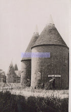 Load image into Gallery viewer, Two oast houses with a bicycle in front, labeled &#39;No Postcards&#39;.
