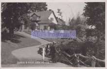 Load image into Gallery viewer, Vintage black and white photo of a house with a person walking a horse, labeled &#39;Mo&#39;s Postcards&#39;.
