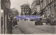 Load image into Gallery viewer, Vintage black and white photo of Market Jew Street, Penzance with people and cars.
