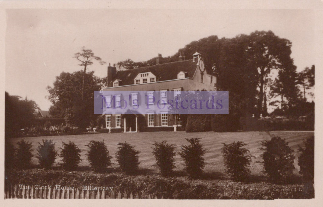 Vintage sepia-toned postcard of a large house with trees and garden.