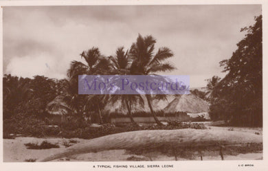 Vintage sepia-toned postcard of a typical fishing village in Sierra Leone with palm trees and huts.