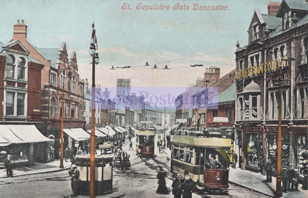 Vintage postcard of a street scene with trams and buildings in Doncaster, featuring sepulchre gate.