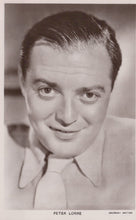 Load image into Gallery viewer, Black and white portrait of a man with a blurred background
