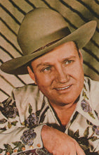 Load image into Gallery viewer, Man wearing a wide-brimmed hat and patterned shirt against a striped background
