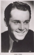 Load image into Gallery viewer, Black and white portrait of a smiling man with text &#39;HENRY FONDA&#39; at the bottom.
