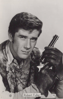Black and white photo of a person holding a gun, with text overlay