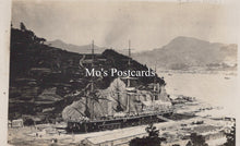 Load image into Gallery viewer, Vintage black and white photograph of a large ship docked at a harbor with mountains in the background  
