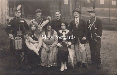 Vintage black and white photo of a group of people in formal attire  