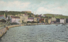 Load image into Gallery viewer, Vintage-style image of a coastal town with buildings and a body of water.
