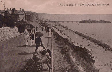 Vintage postcard of a pier and beach from West Cliff, Bournemouth