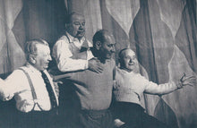 Load image into Gallery viewer, Black and white photograph of four men posing together against a curtain backdrop
