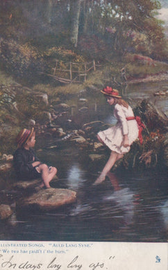 Two children by a stream in a forest setting with text at the bottom.