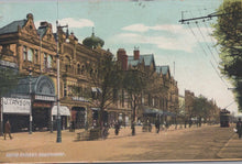 Load image into Gallery viewer, Vintage street scene with historical buildings and people on a city street.
