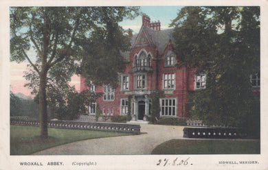 Vintage postcard of Wroxall Abbey with a red brick building and trees.