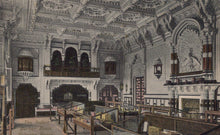 Load image into Gallery viewer, Decorative interior of a building with ornate architecture and furniture.
