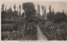 Load image into Gallery viewer, Vintage postcard of a garden path with trees and bushes
