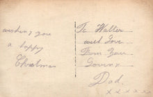 Load image into Gallery viewer, Handwritten Christmas message on a vintage card with decorative elements.
