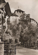 Load image into Gallery viewer, Vintage black and white photo of a castle with a crucifix on a stone wall.
