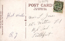 Load image into Gallery viewer, Vintage postcard with handwritten address and a stamp on a light brown background

