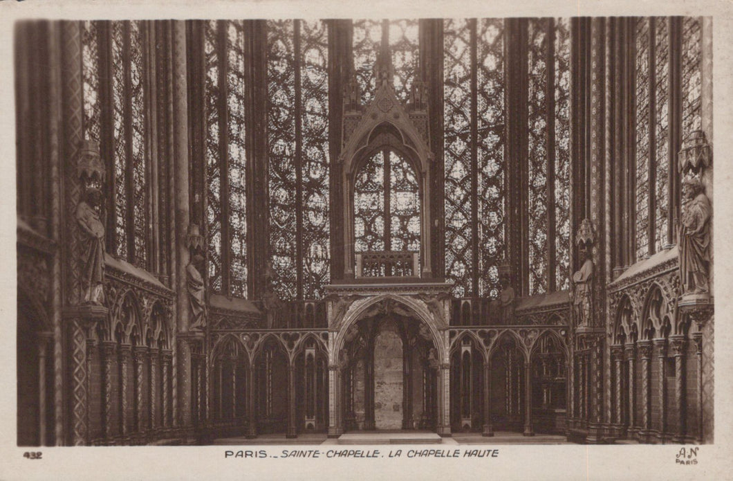 Gothic interior of Sainte-Chapelle with intricate stained glass windows.