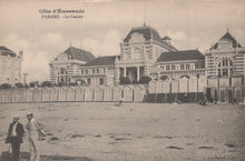 Load image into Gallery viewer, Vintage black and white photo of a coastal scene with buildings and beach huts.
