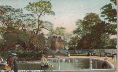 Vintage postcard of a pond with people and trees in the background