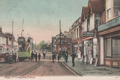 Vintage street scene with a tram and pedestrians in Poole, featuring shops and buildings.