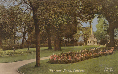 Manor Park in Sutton with a path, trees, and floral beds.
