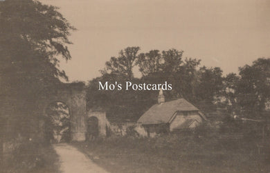 Vintage-style photo of a rustic scene with trees and a building, labeled 'Mo's Postcards'.