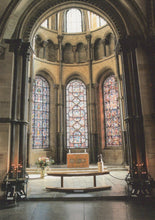 Load image into Gallery viewer, Altar with stained glass windows in a cathedral setting

