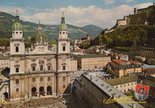 Load image into Gallery viewer, Historic cityscape with prominent building and mountains in the background
