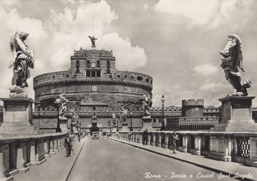 Vintage black and white photo of Castel Sant'Angelo in Rome with statues on either side.