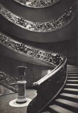 Spiral staircase with decorative balustrade in black and white