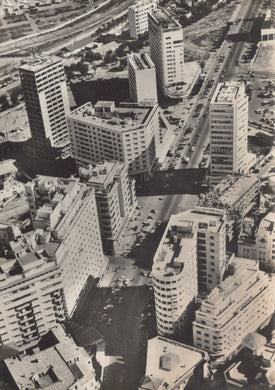 Aerial view of a cityscape with modern buildings