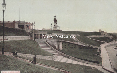 Vintage black and white photo of a lighthouse and steps with 'Mo's Postcards' text overlay.