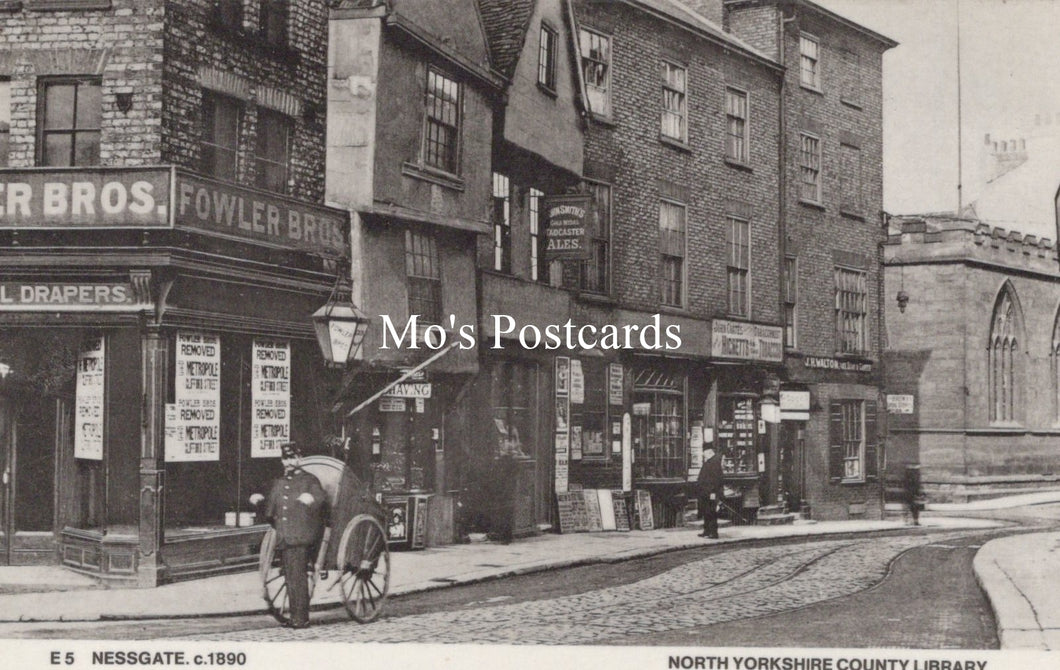 Vintage black and white photograph of a street scene with shops and a horse-drawn carriage 