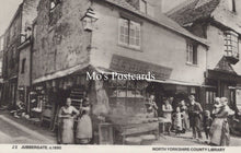 Load image into Gallery viewer, Vintage black and white photo of a street scene with people and buildings
