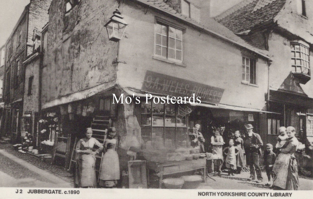 Vintage black and white photo of a street scene with people and buildings