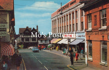 Load image into Gallery viewer, Vintage street scene with pedestrians and shops 
