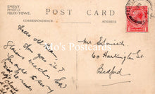Load image into Gallery viewer, Vintage postcard with handwritten text and a red postage stamp 
